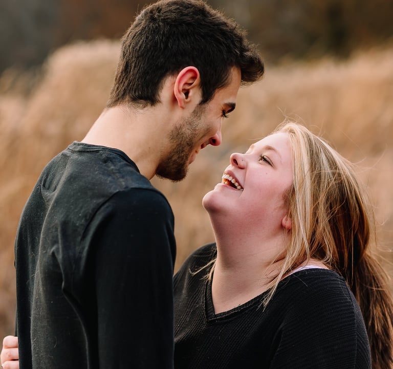 Young couple smiling at each other