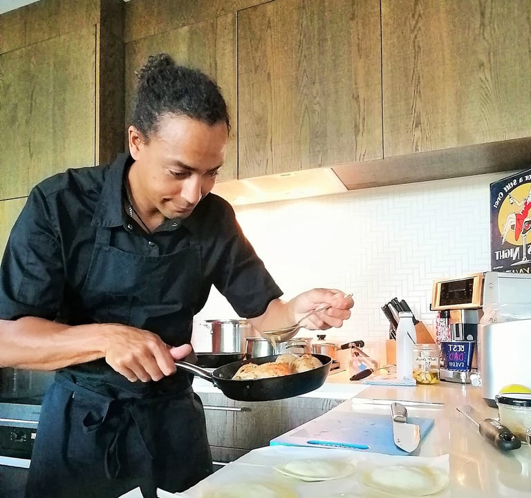 a chef is cooking with a pan