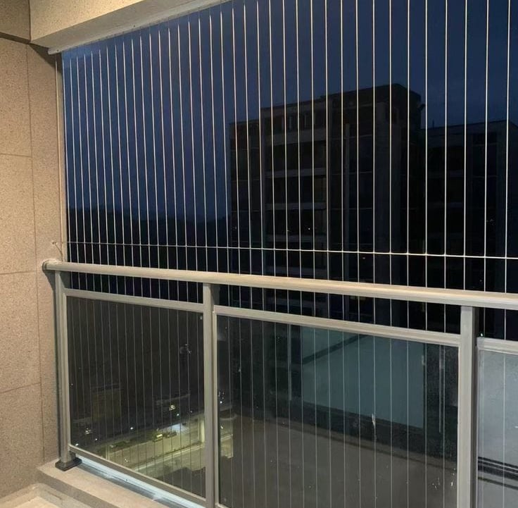 a balcony with a balcony with a view of the city with invisible grills in bengaluru