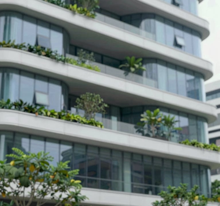 Modern architectural detail of a sustainable building in Singapore, showing clean glass lines and lush greenery. The image uses a palette of #658BA3 and #F8F6F1, conveying grounded authority and sophisticated regional structure.