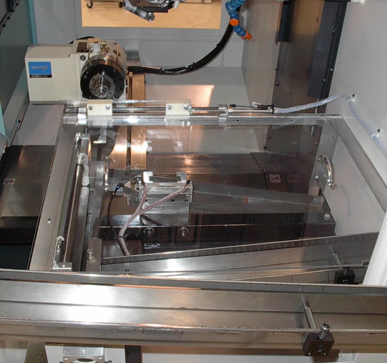 Robot loading cell for high volume small parts