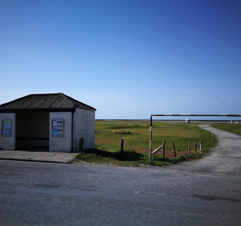Ynyslas turn bus stop and track leading into the campervan car park