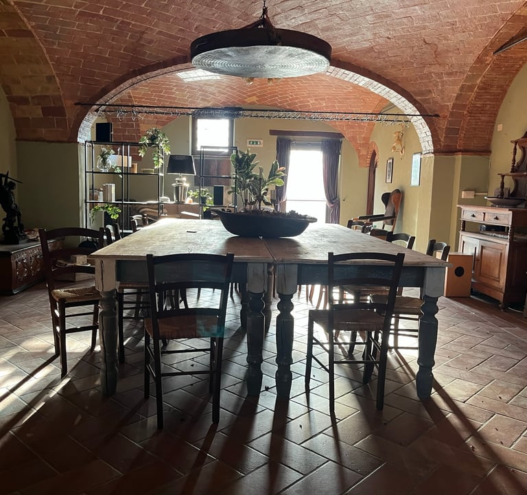 a dining room with a table and chairs