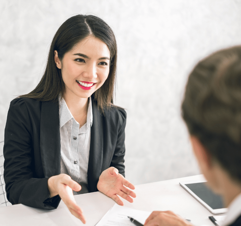professional resume writer discussing with job applicant on how to improve his resume