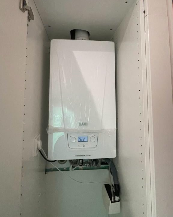 a tankless water heater in a cabinet