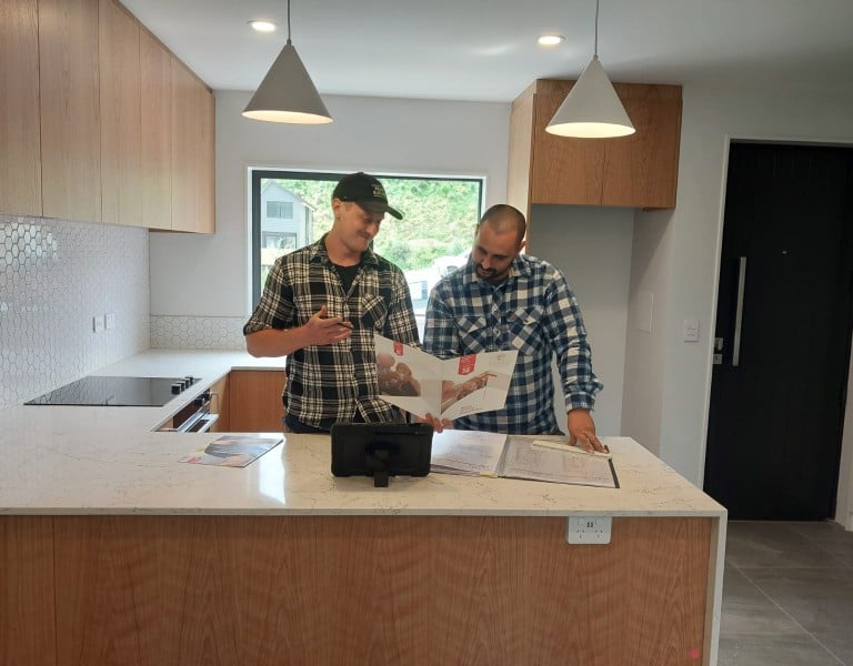 Terence and Denym in a kitchen