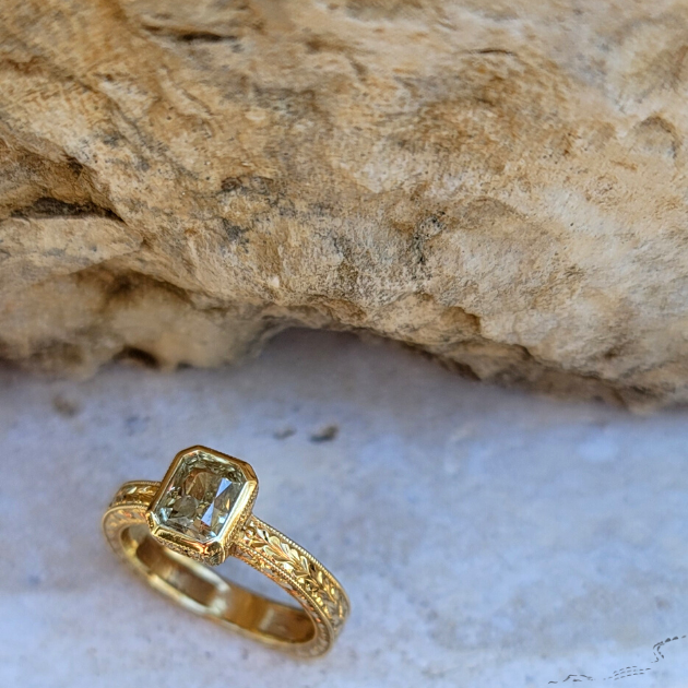 Chael jewelry - custom yellow diamond ring set in gold with limestone in the background
