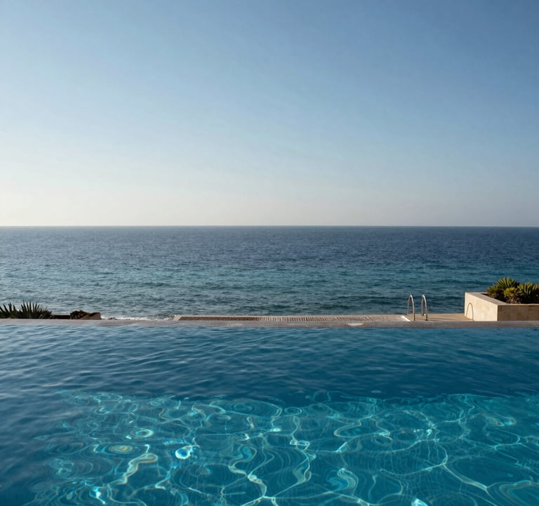 An elegant infinity pool on a private terrace in Netanya, merging visually with the blue waters of the Mediterranean Sea under a clear sky.