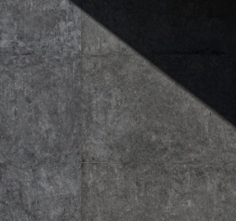 A high-contrast photography of a heavy, dark-grey textured concrete wall with a single sharp shadow falling diagonally across it. The composition is minimalist and architectural, conveying a mood of absolute control and stability in a North American / International Business context.