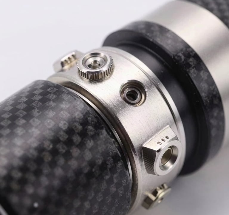 Macro photography of high-quality metallic silver components and dark charcoal carbon fiber, representing advanced technology and manufacturing excellence, clean studio lighting.