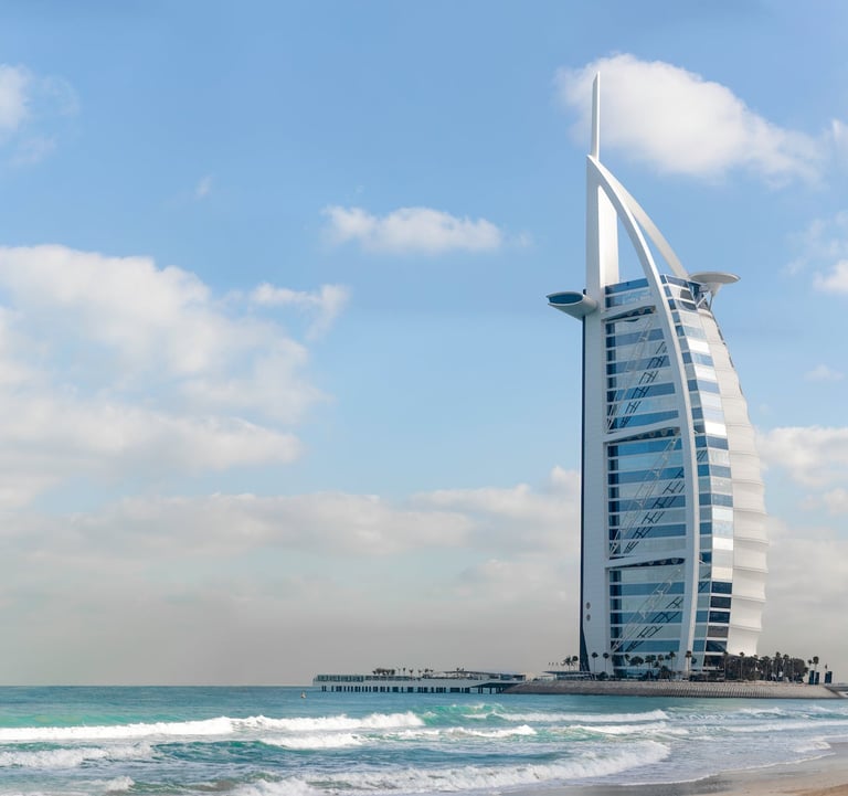Dubai ,a tall building with a tall tower in the background
