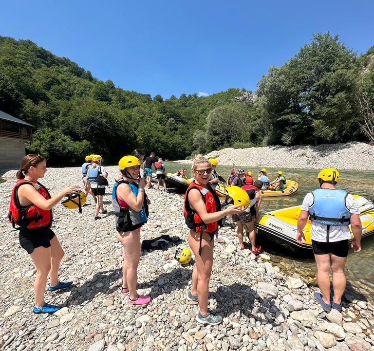 Guests preparing for their rafting experience on the Neretva River