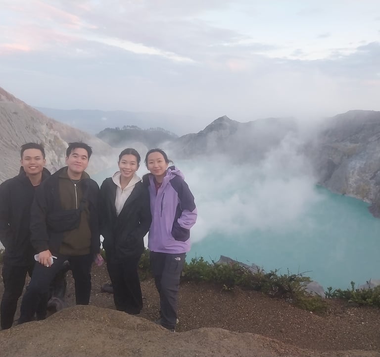 a group of people standing on a mountain top