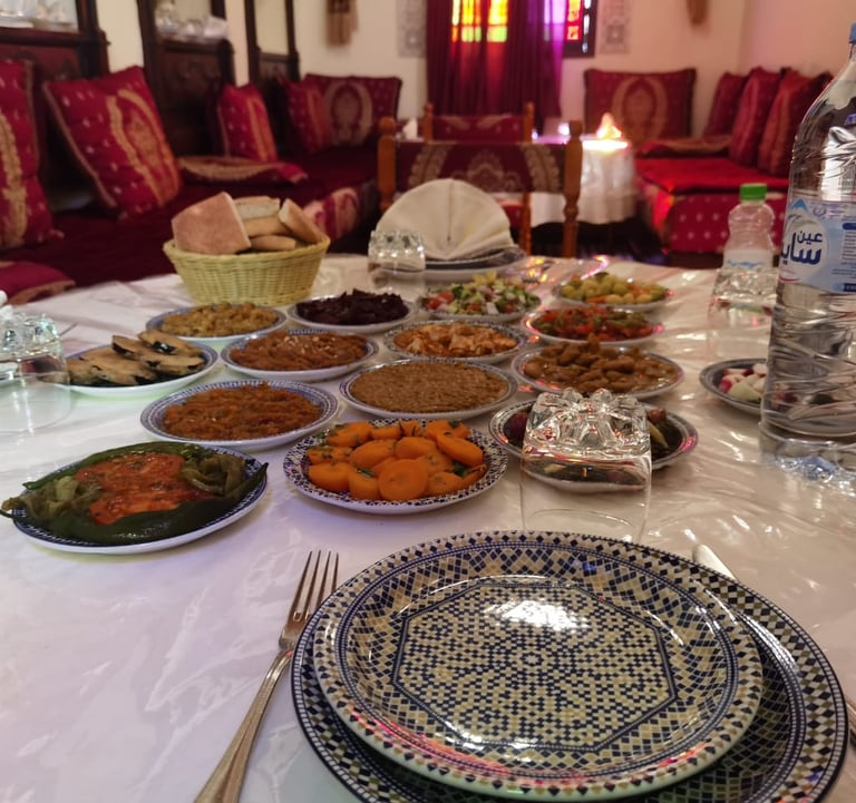 a table with plates of food and drinks