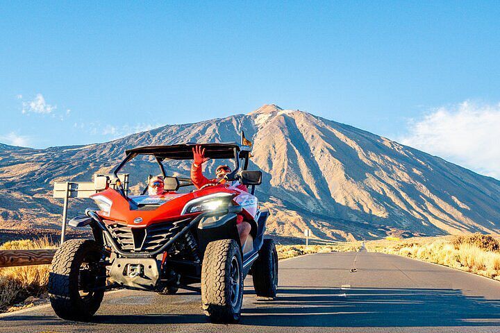 a person riding a quad - bike on a road