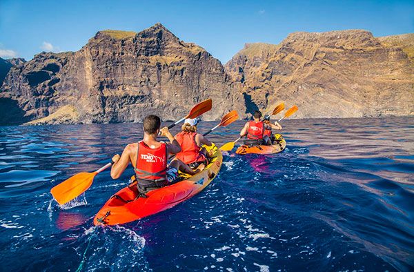 a group of people kayaking in kayaks