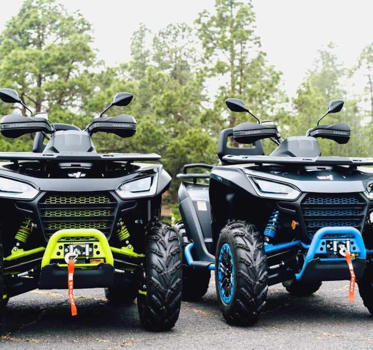 two atv atvs parked in a parking lot