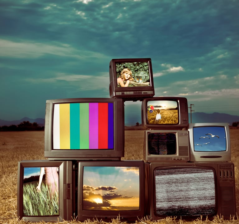 Image of abandoned televisions in a desert representing made-for-TV screenplays built for serialized