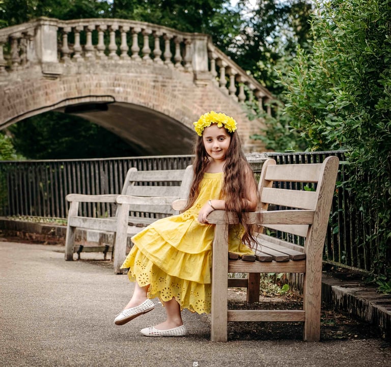 Girl sitting on bench by bridge – Fred Art Studio outdoor photography