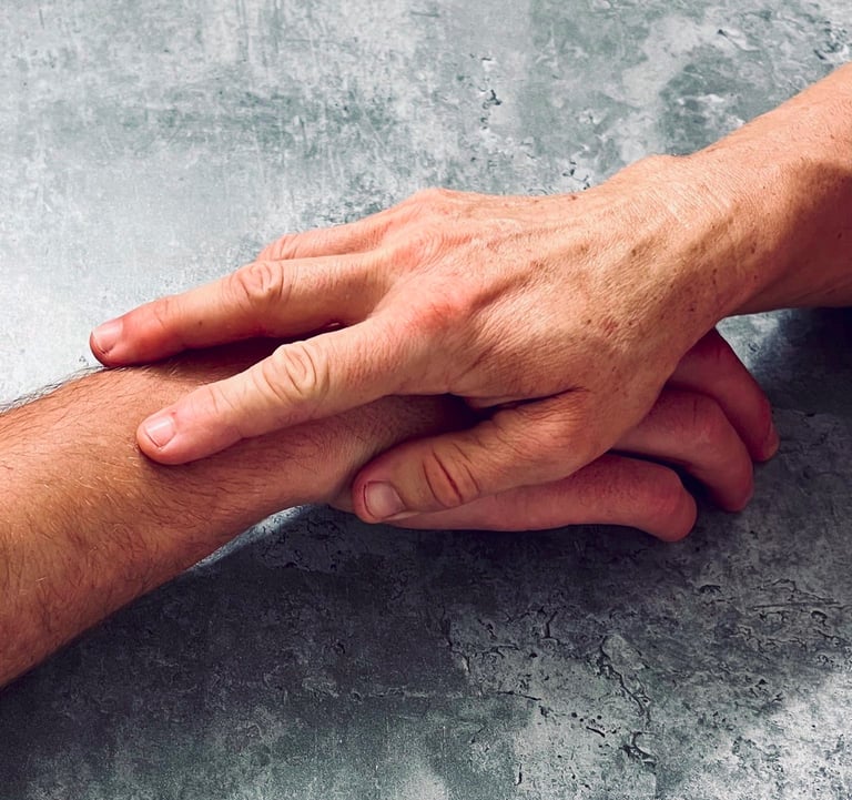 a man holding a hand of another hand