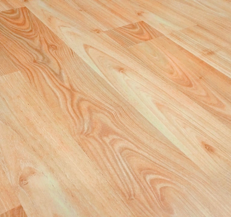 Light brown oak laminate flooring with realistic wood grain texture for home interior design.