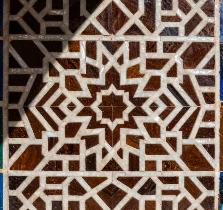 Detailed photography of intricate Zellige tilework on a wall, featuring geometric patterns in deep espresso and pearly off-white.