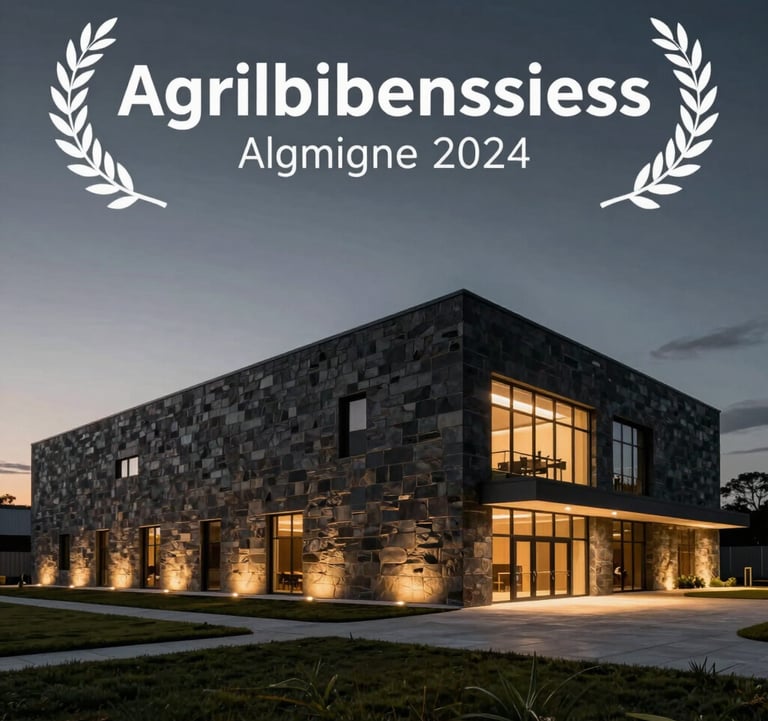 A professional architectural photograph of a modern, minimalist agribusiness processing facility at dusk. The building features crisp lines and dark stone cladding, illuminated by soft golden exterior lights under a dark charcoal sky.