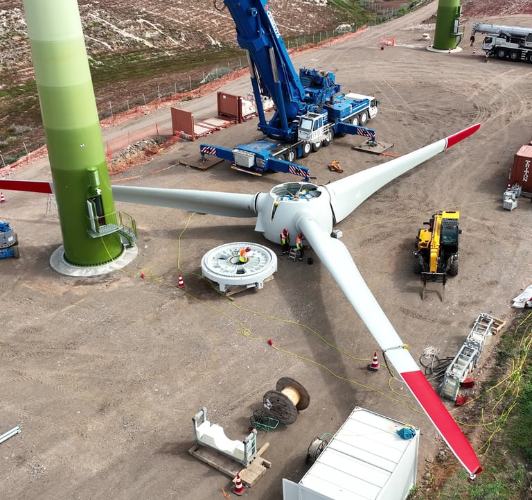 a wind turbine being worked on by a crane