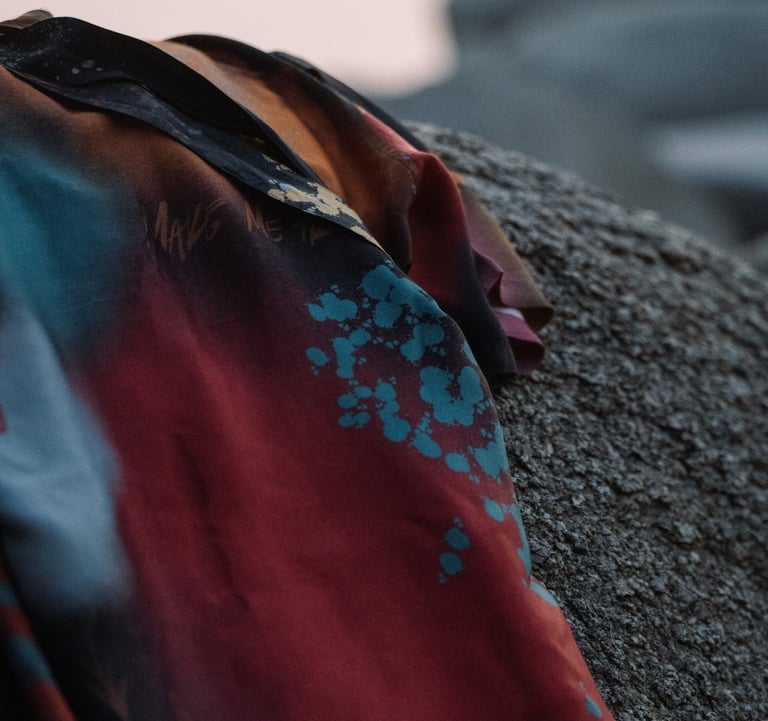 Close-up of the fabric of a Boho Graffiti Kimono, showcasing its vibrant, artistic design and rich c