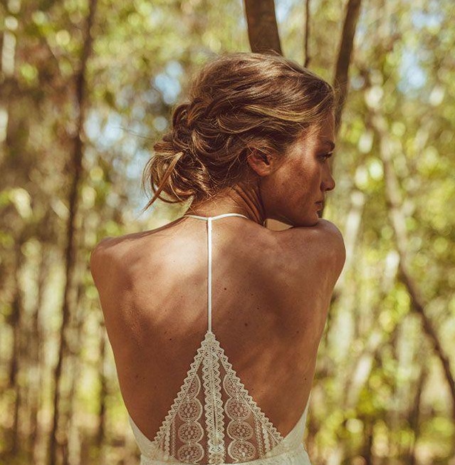 Messy bridal hairstyle for UHMA bridal dress salon with open back model