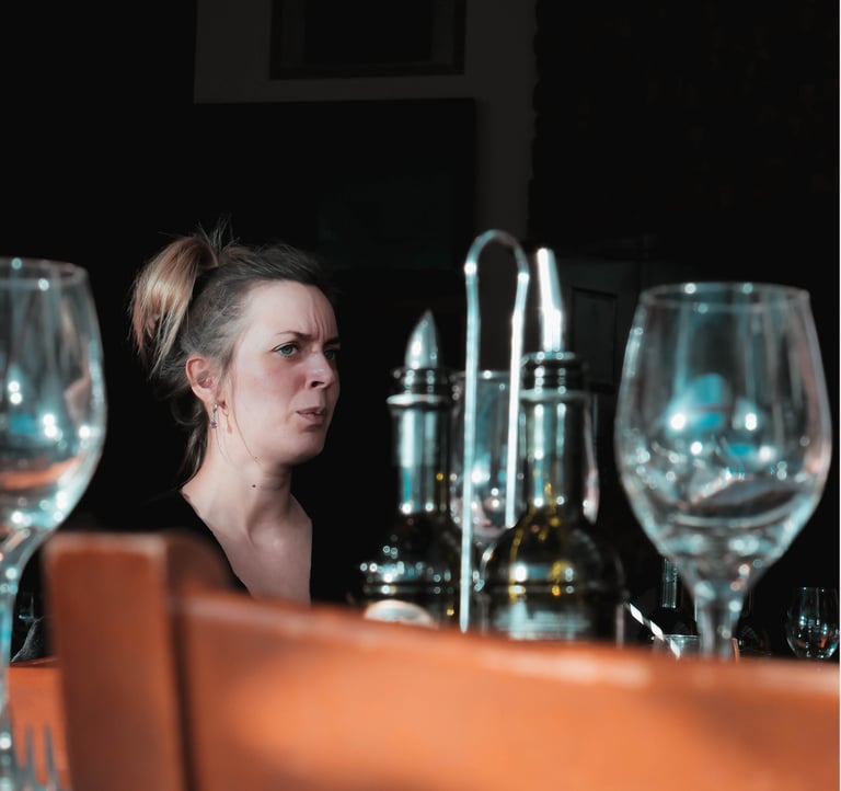 Young lady lost in her thoughts whilst in a restaurant 