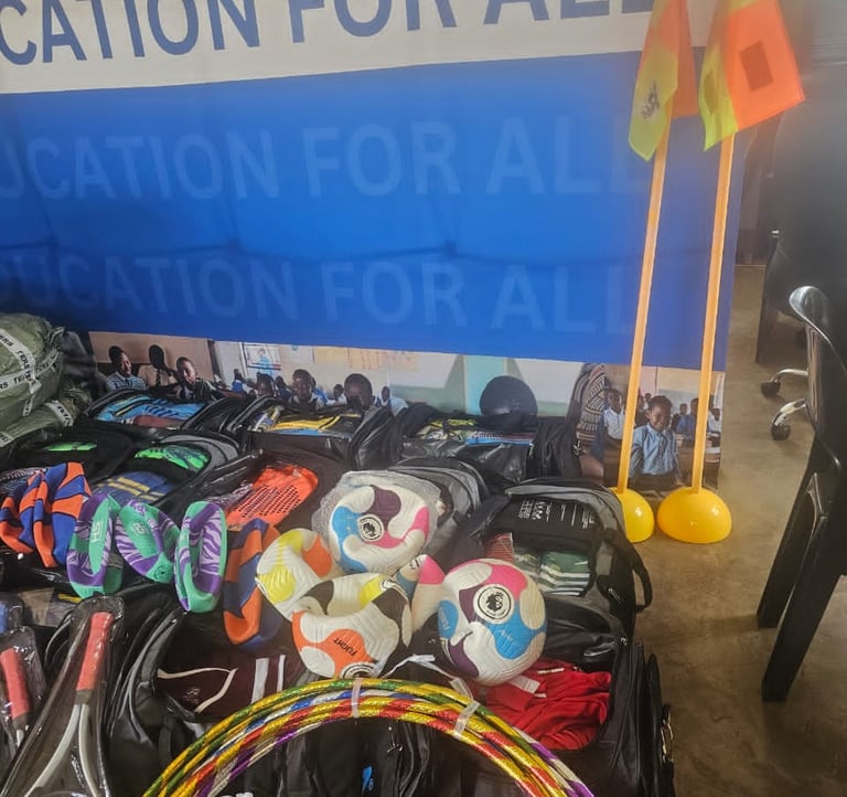 a bunch of bags with sports items and a wall banner