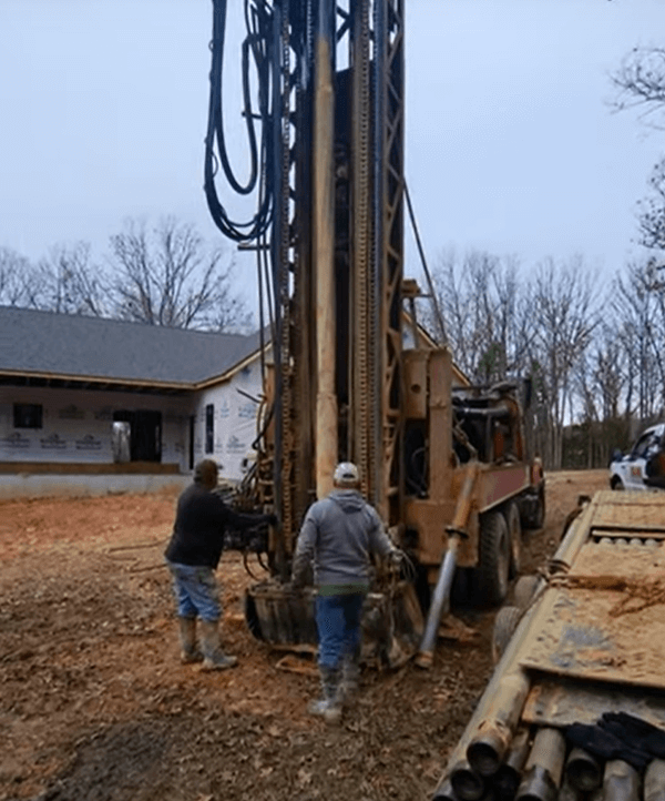well drilling truck backs up