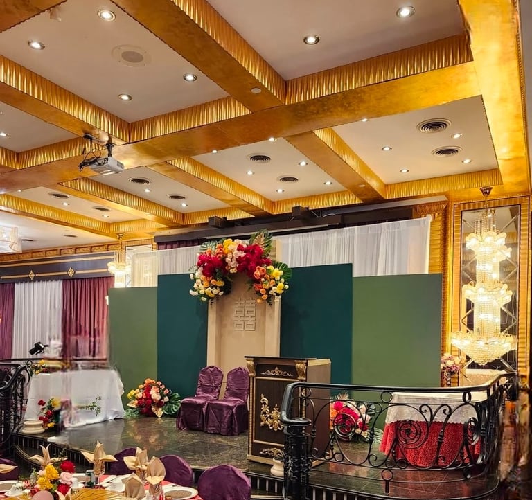 Elegant Chinese tea ceremony stage setup featuring layered green backdrop panels, a traditional wood