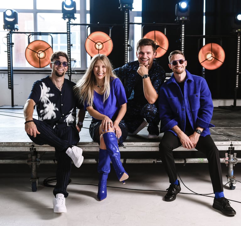a group of people sitting on a stage