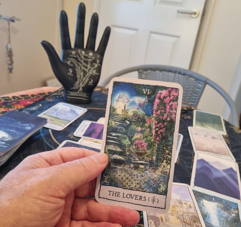 rob hamilton holding a tarot card