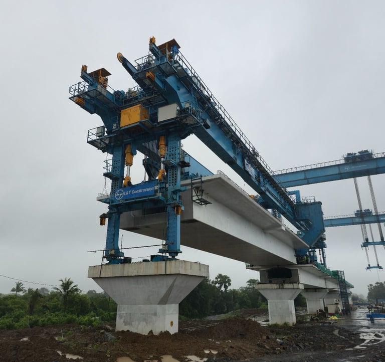 A heavy-duty blue girder launcher crane installs concrete segments for a highway bridge project.