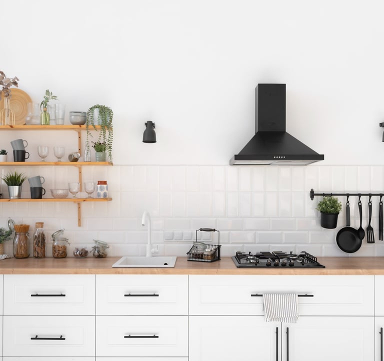 a kitchen with a stove top and shelves with pots and utensils