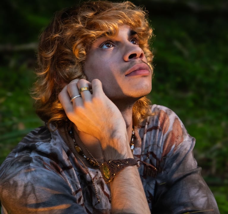 a man with red hair and a ring on his finger