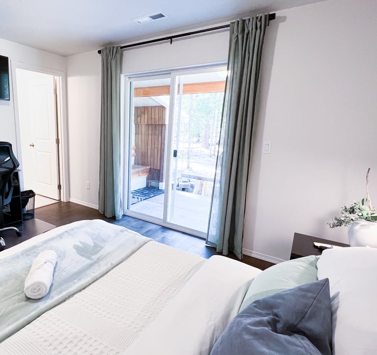 a bedroom with a desk and a chair