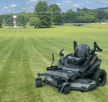 mower at idle with cut grass in background