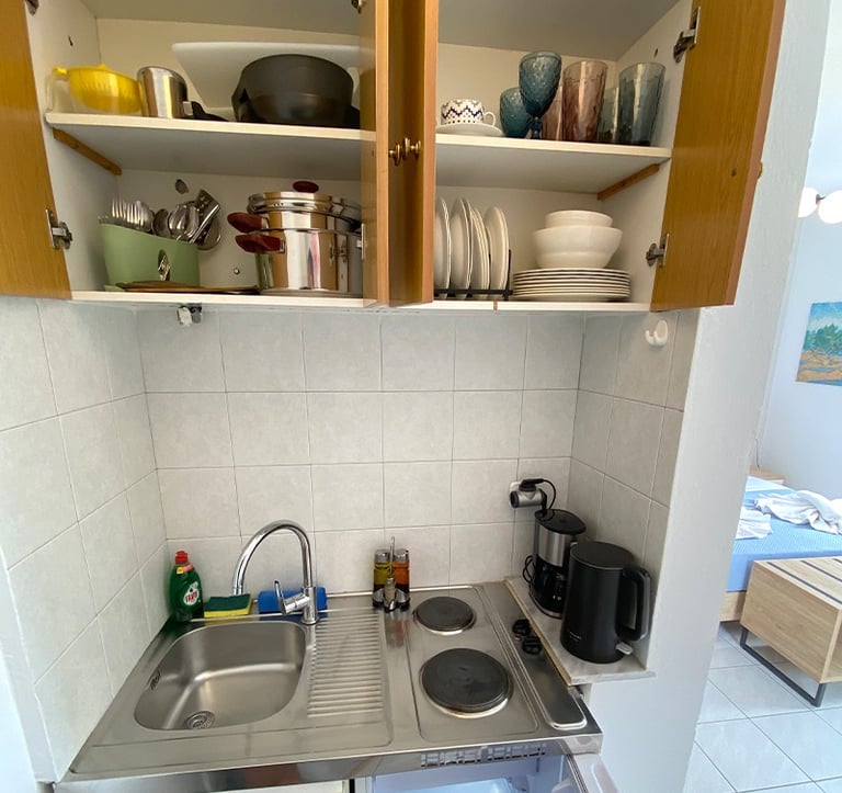 a kitchen with a sink and a microwave