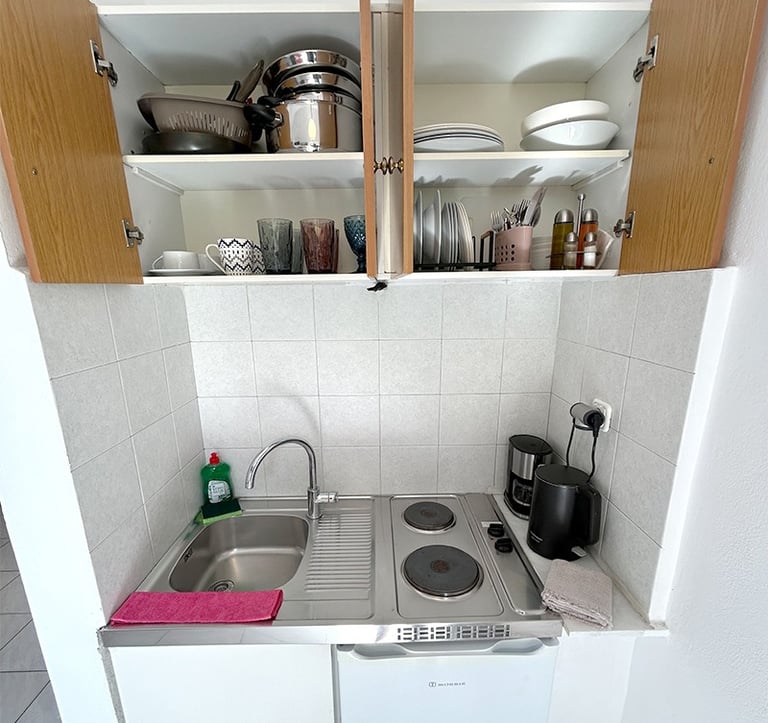 a kitchen with a sink and a stove top