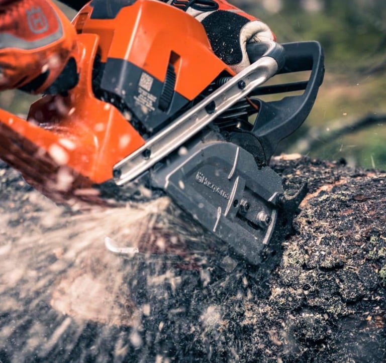 chainsaw cutting a log