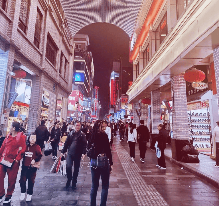 a group of people walking down a street