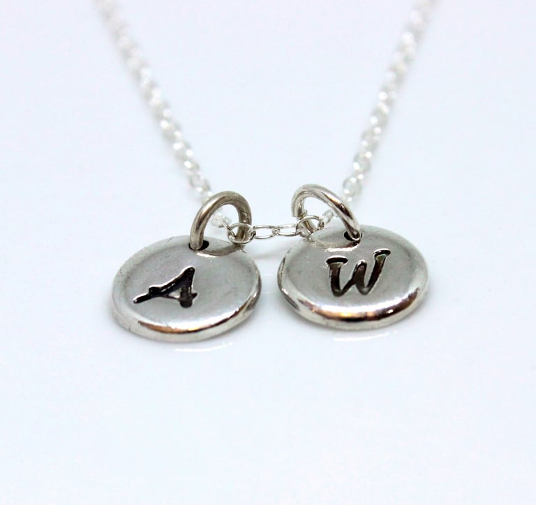 Silver jewellery personalised with initials, names, dates and messages 