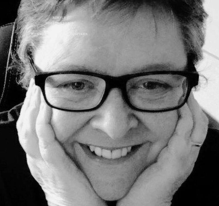 Nella D with head in hands