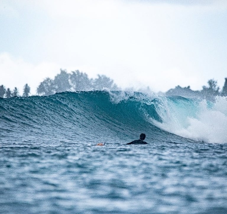 a man ready for his wave to ride it