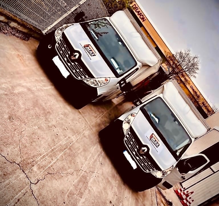 two trucks parked in a parking lot