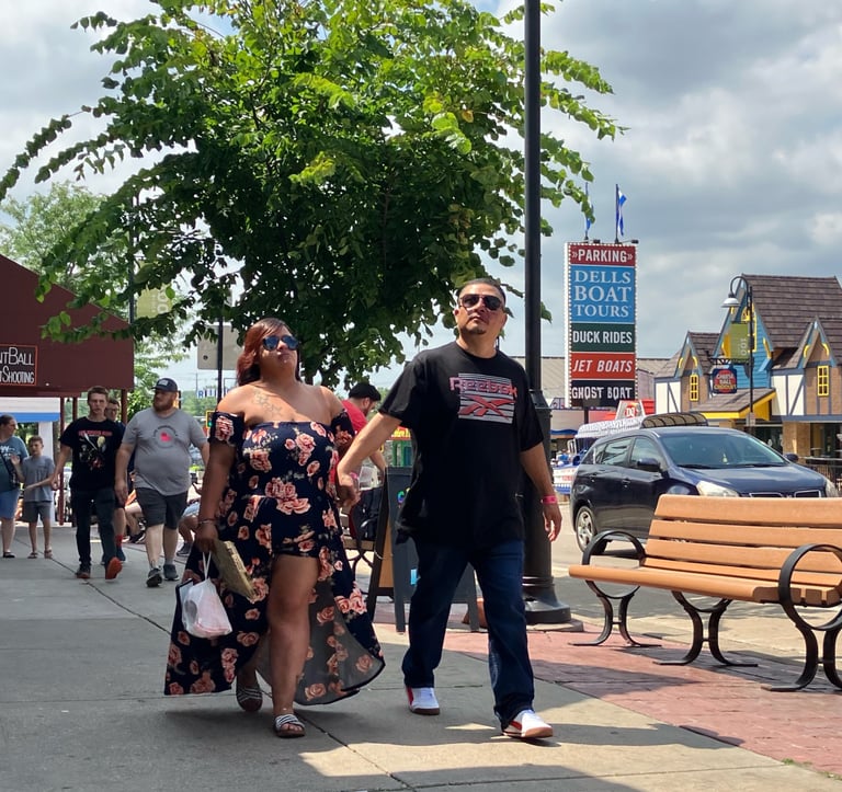 A couple enjoying a walk down Broadway in the Wisconsin Dells
